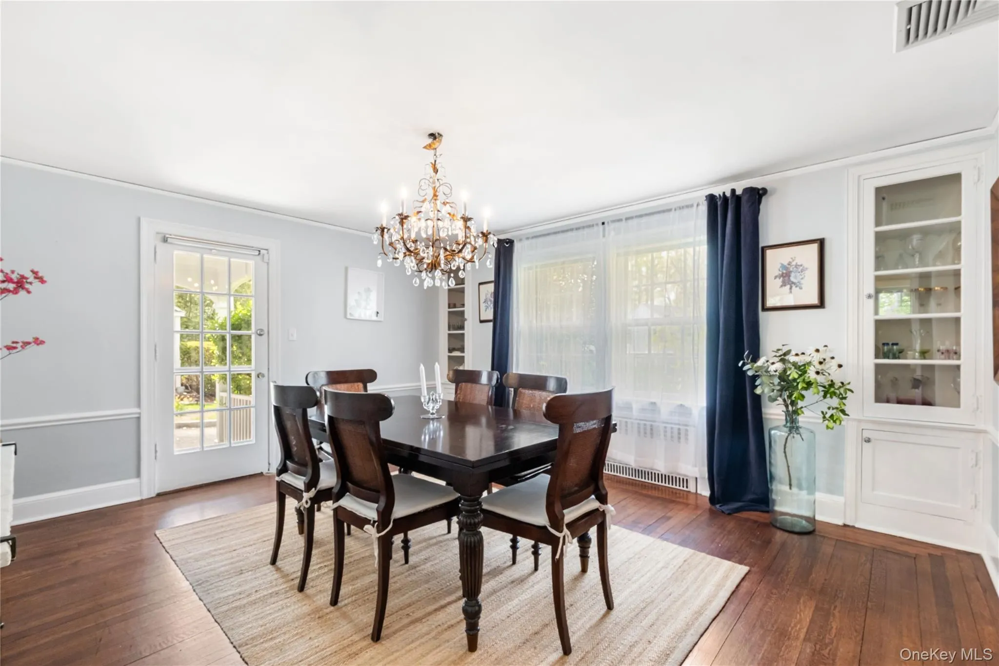 Dining room showing door to covered porch on side of house Dining room showing door to covered porch on side of house