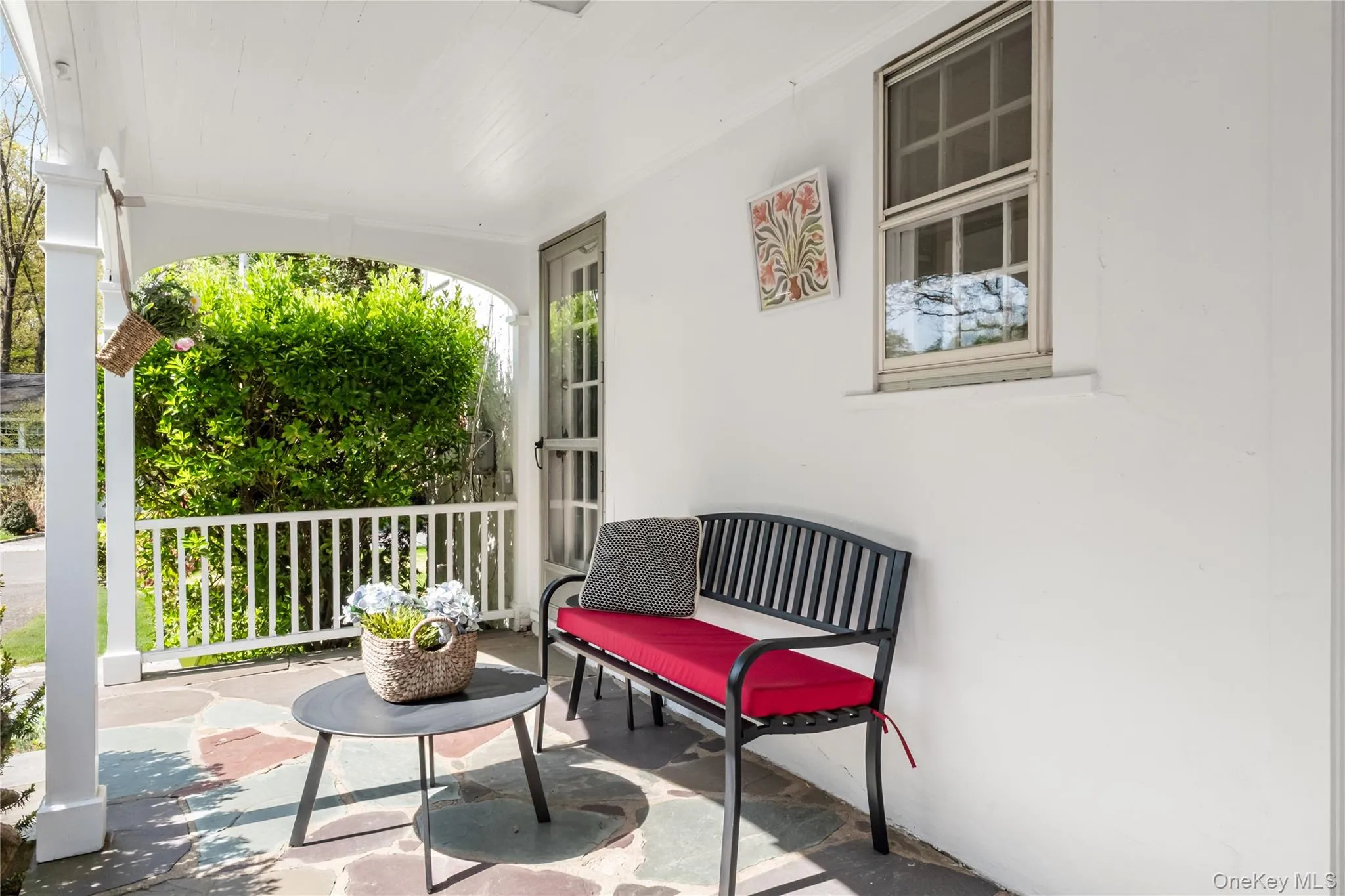 Convenient covered porch on side of house with entry to dining room, kitchen and two car attached garage Convenient covered porch on side of house with entry to dining room, kitchen and two car attached garage