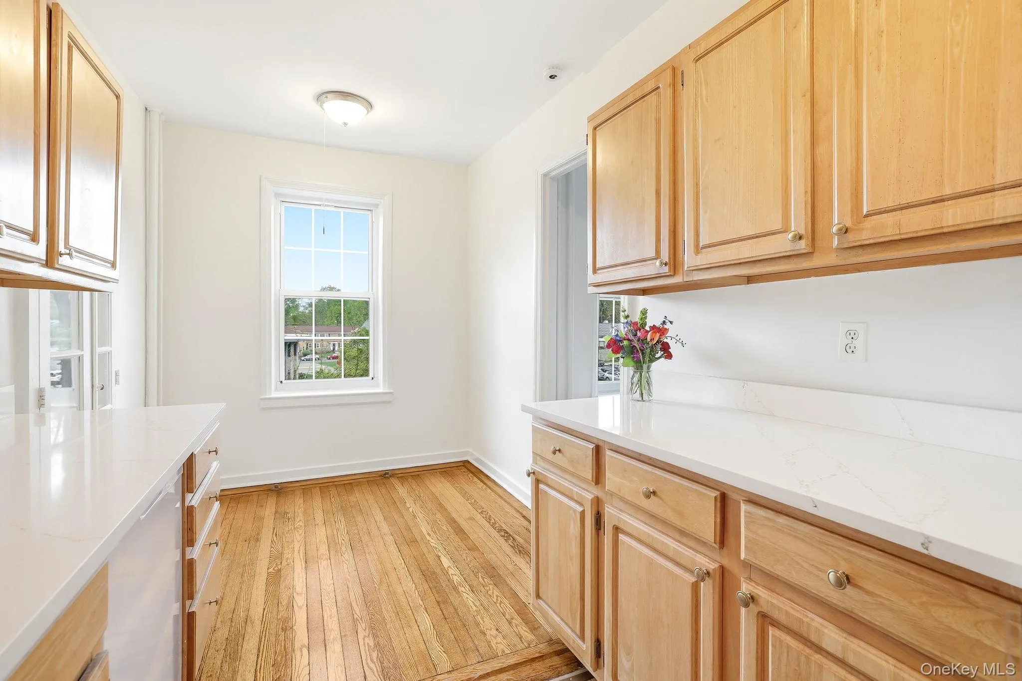 There are new white quartz countertops with an undermount stainless steel sink and faucet, in addition to a new dishwasher There are new white quartz countertops with an undermount stainless steel sink and faucet, in addition to a new dishwasher