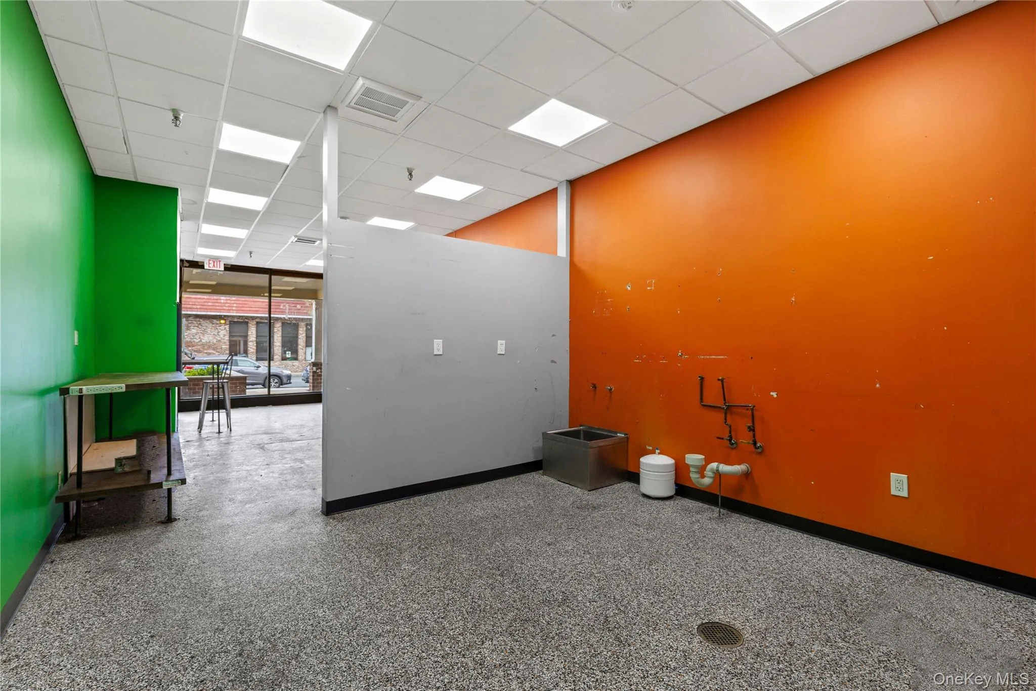 existing condition with partition wall for prep space. existing condition with partition wall for prep space.