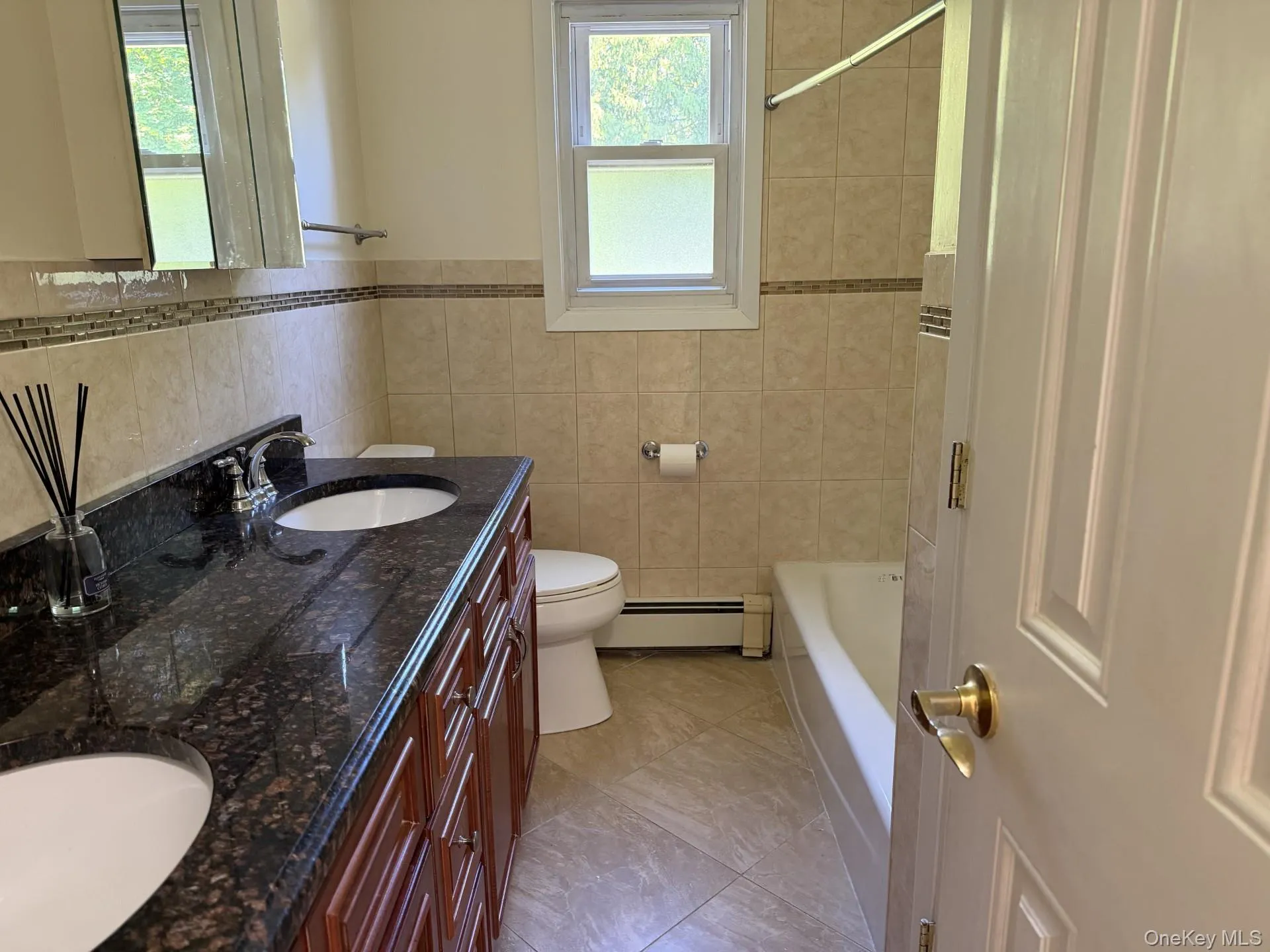 totally updated double vanity, mirror, granite countertop. totally updated double vanity, mirror, granite countertop.