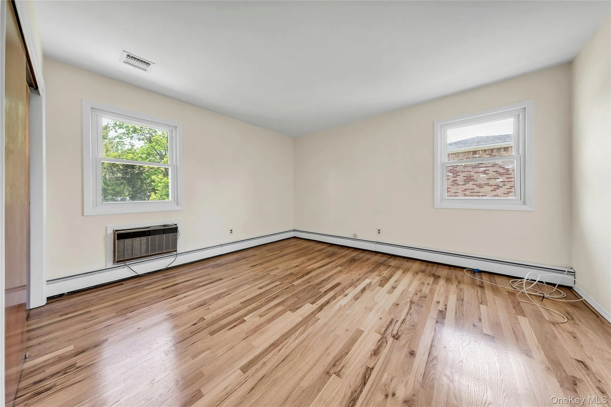 1st Large primary bedroom with hardwood floors and walk in closet. 1st Large primary bedroom with hardwood floors and walk in closet.