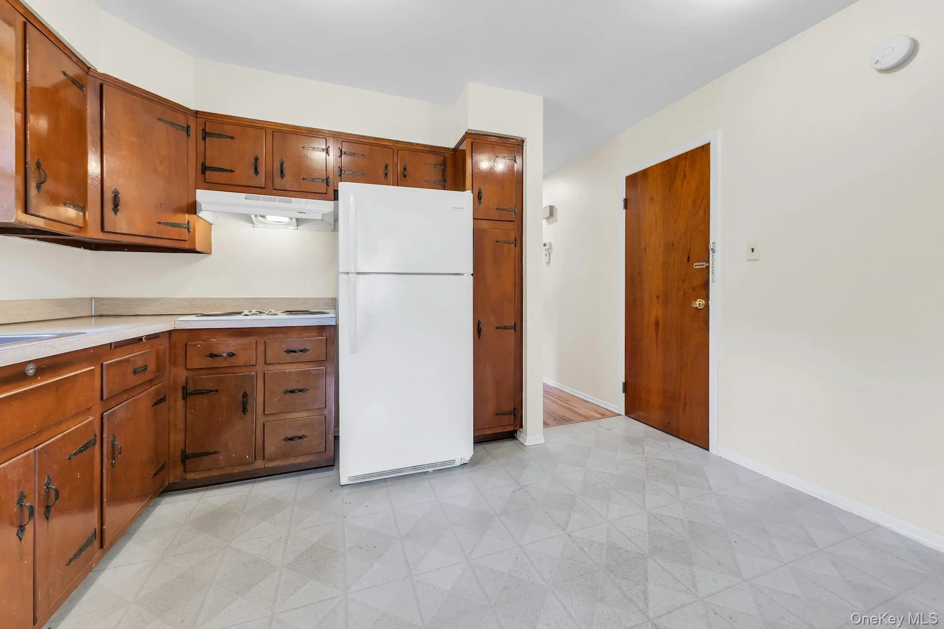 Kitchen with wood cabinets. Kitchen with wood cabinets.