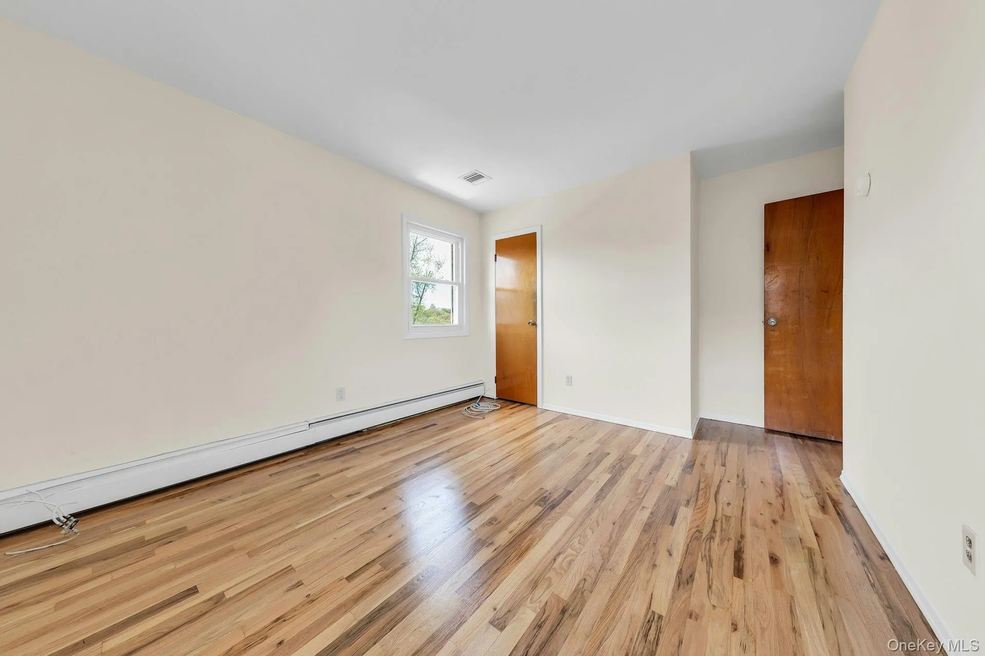 Third bedroom with hardwood floors, walk in closet plus windows. Third bedroom with hardwood floors, walk in closet plus windows.