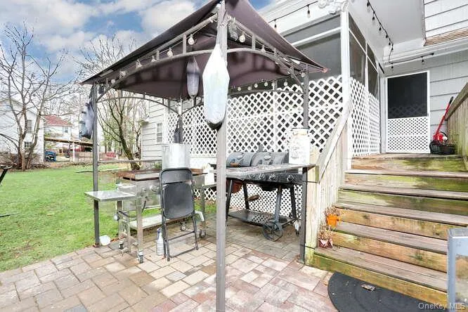 View of patio / terrace featuring a grill View of patio / terrace featuring a grill
