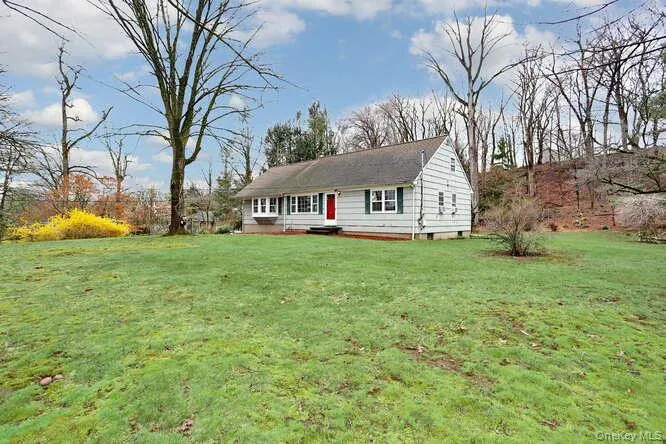 Ranch-style house featuring a front lawn Ranch-style house featuring a front lawn