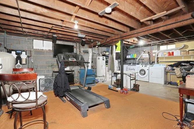 Basement with water heater and separate washer and dryer Basement with water heater and separate washer and dryer