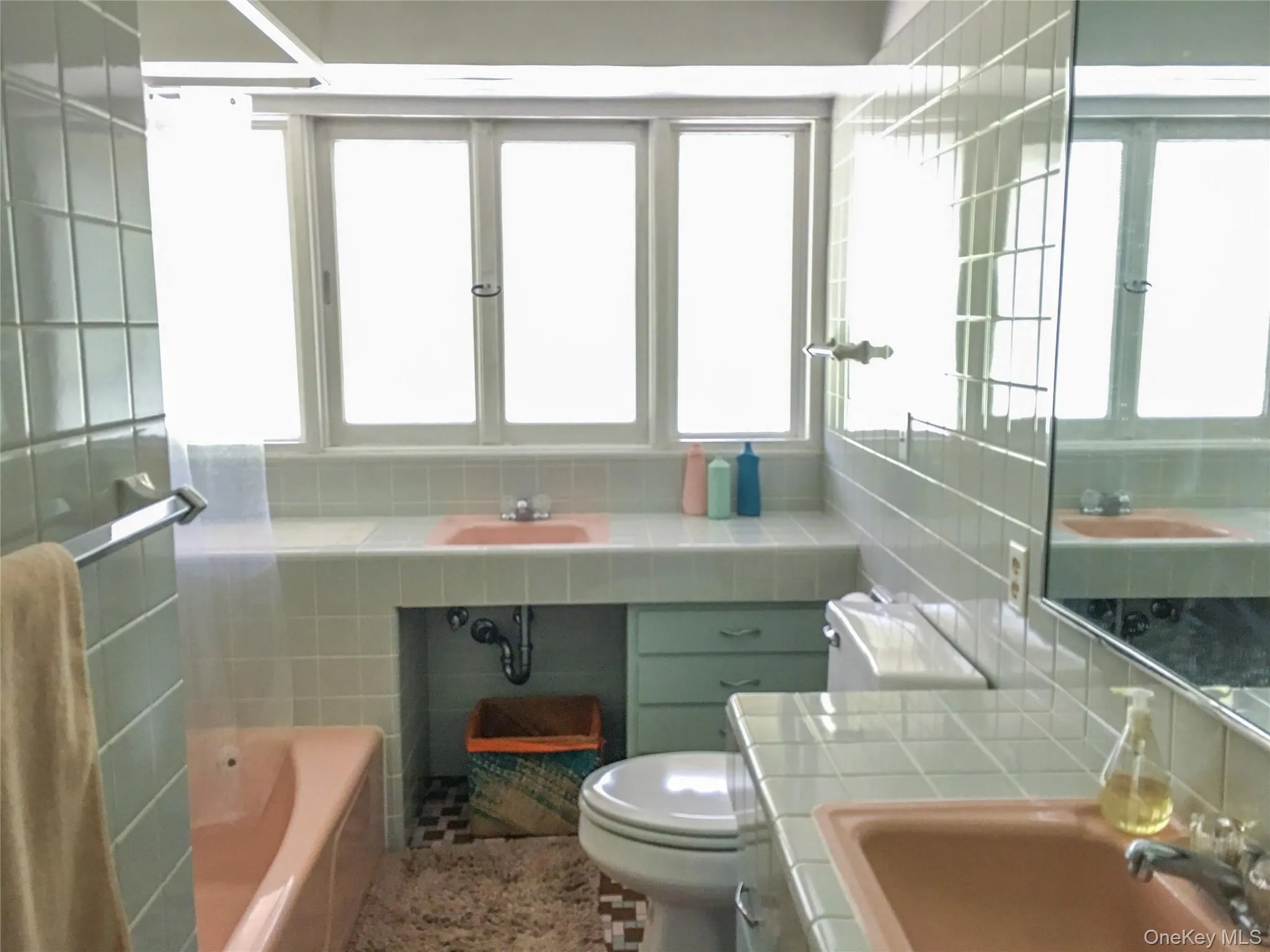 Full bathroom with two sink areas Full bathroom with two sink areas
