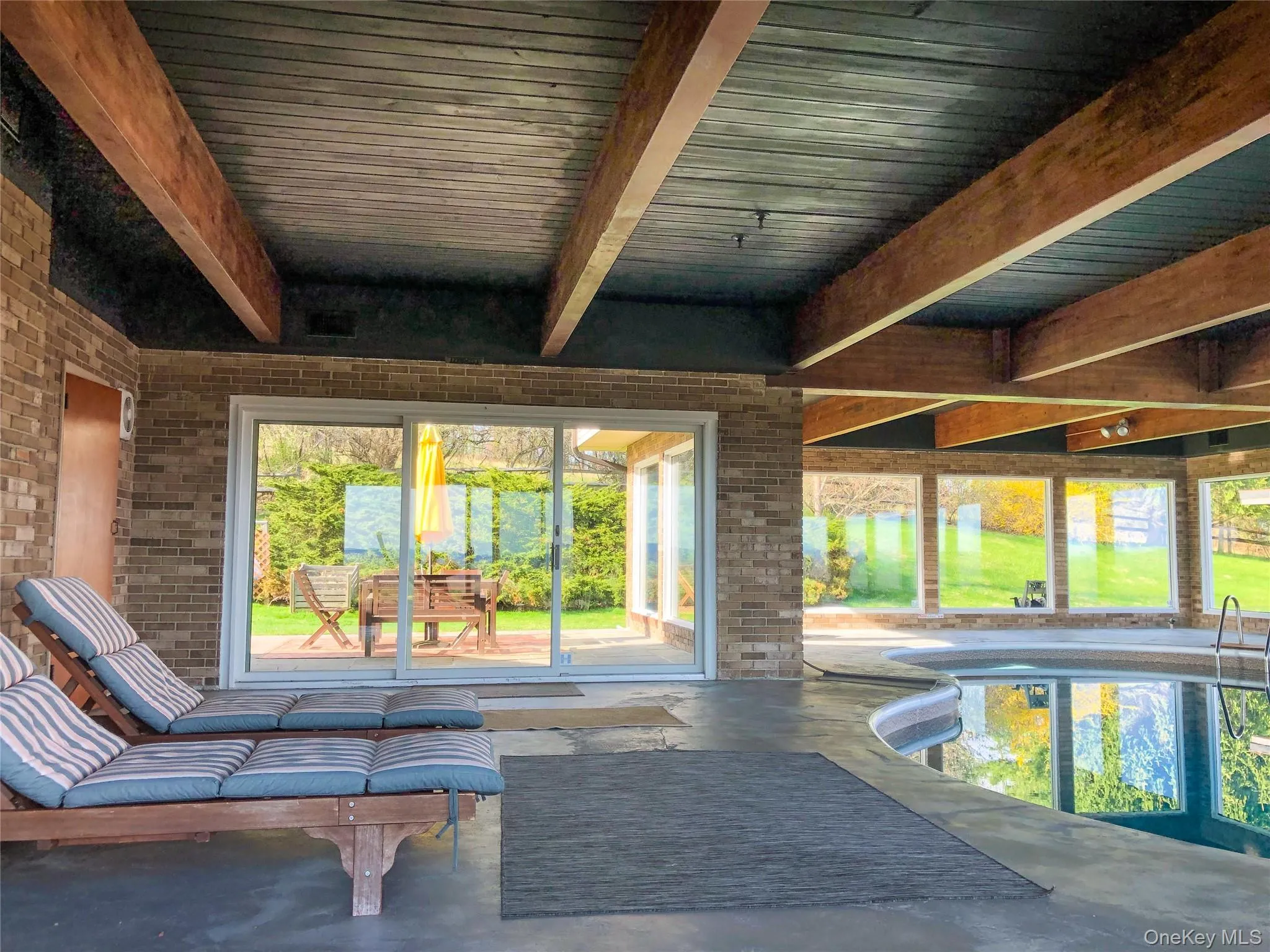 Indoor pool with doors to back terrace/patio Indoor pool with doors to back terrace/patio