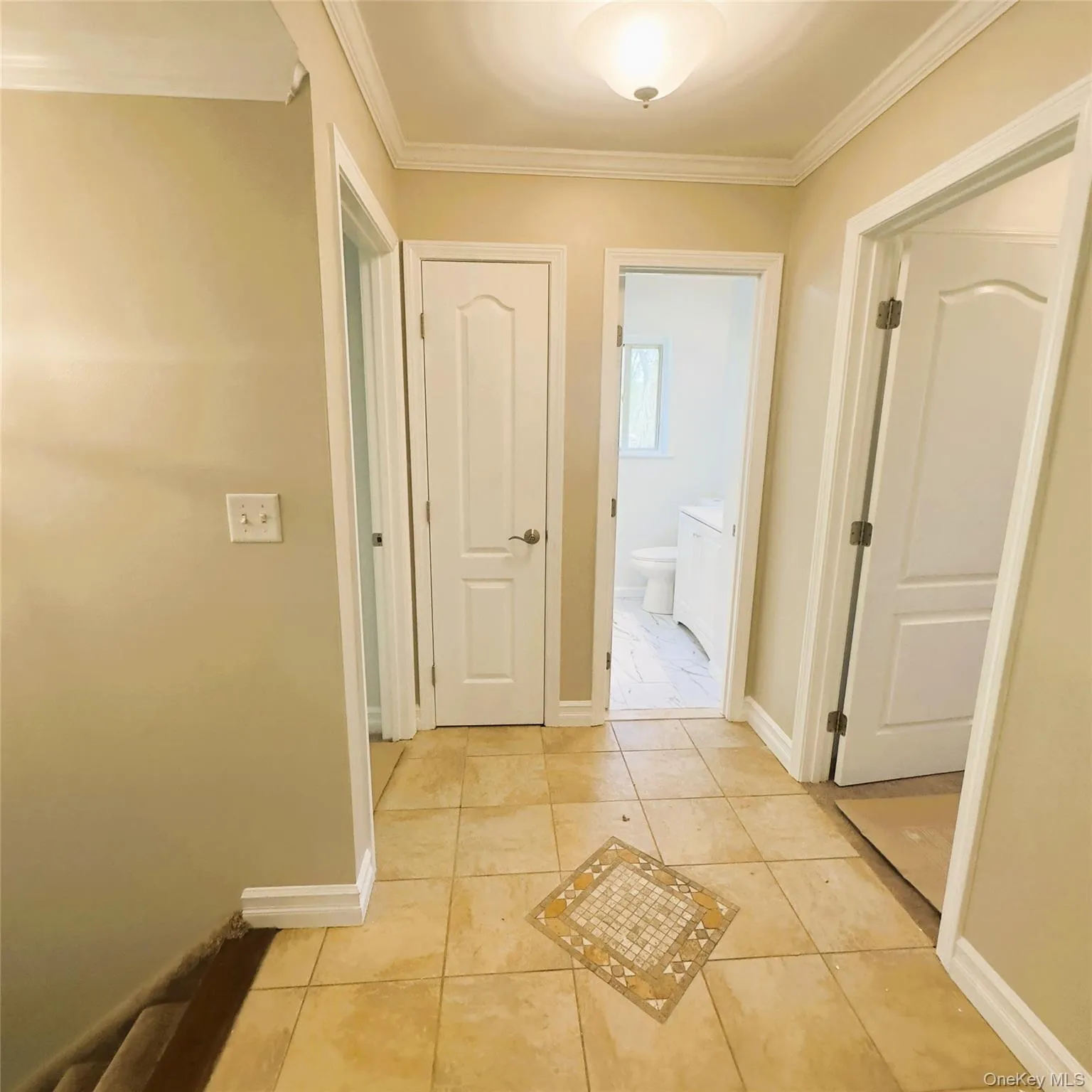 Ceramic flooring, light fixture, linen closet, crown molding. Ceramic flooring, light fixture, linen closet, crown molding.
