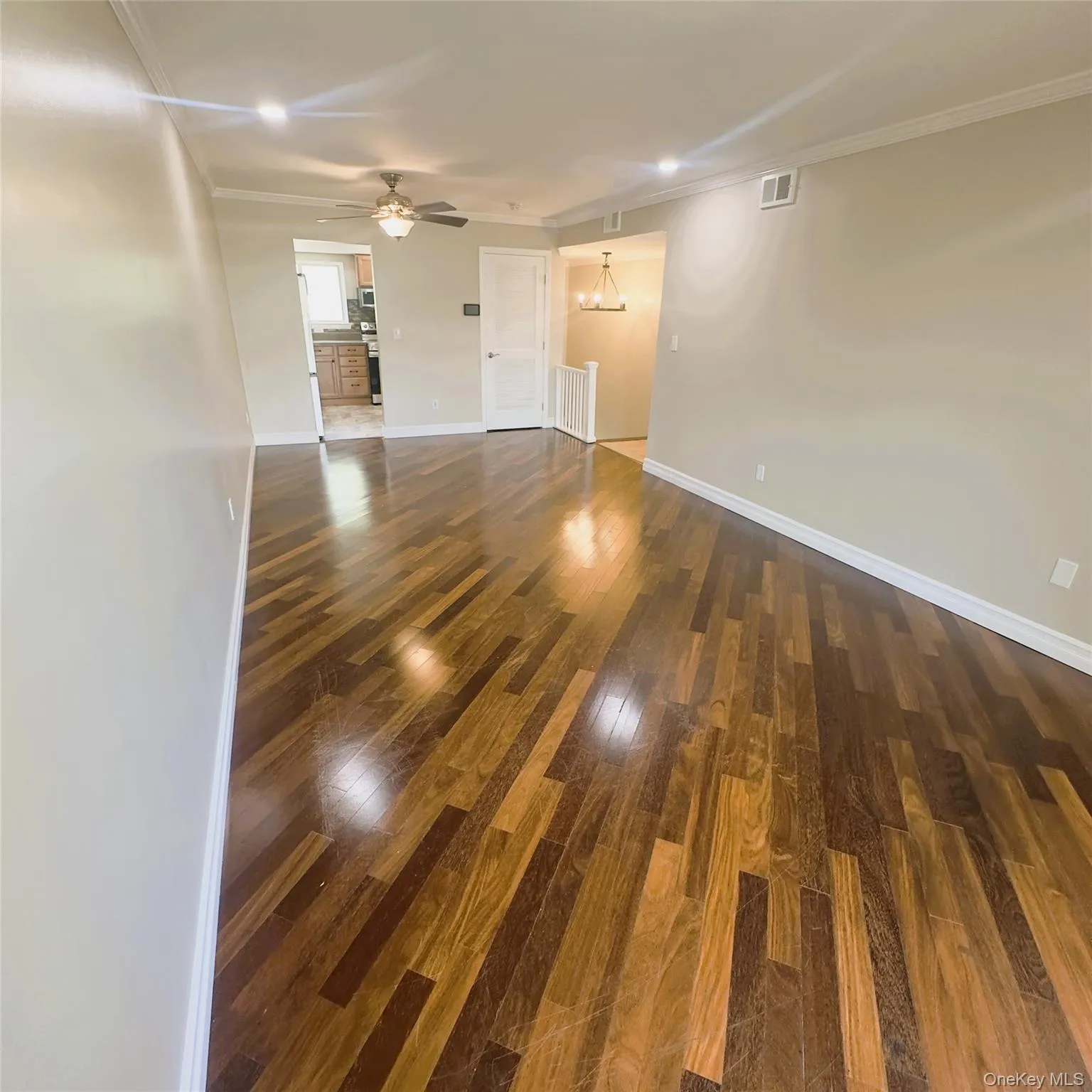 Wooden flooring, recess lighting, crown molding. Wooden flooring, recess lighting, crown molding.