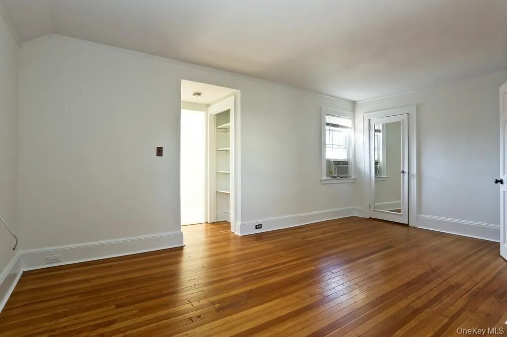 primary bedroom with walk in closet primary bedroom with walk in closet