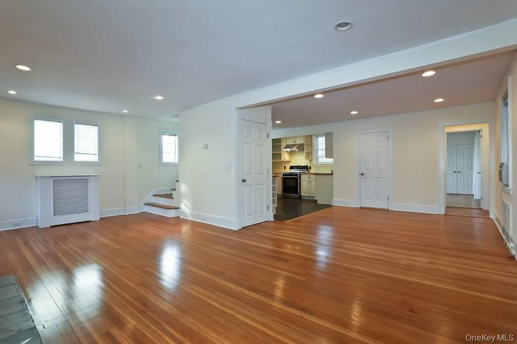 open floor plan living room, dining room and renovated kitchen open floor plan living room, dining room and renovated kitchen