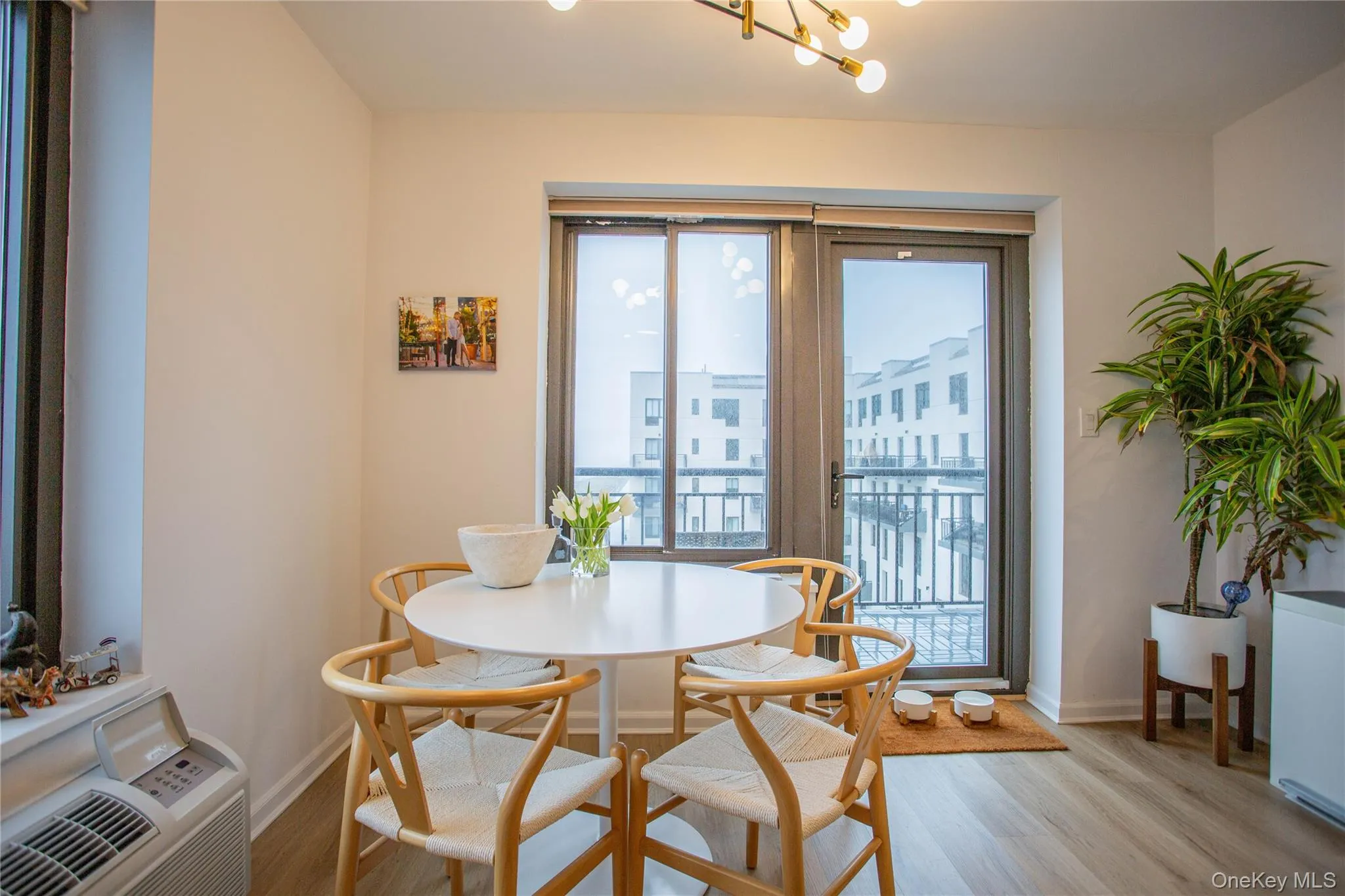 Dining space with light wood-style flooring and baseboards Dining space with light wood-style flooring and baseboards