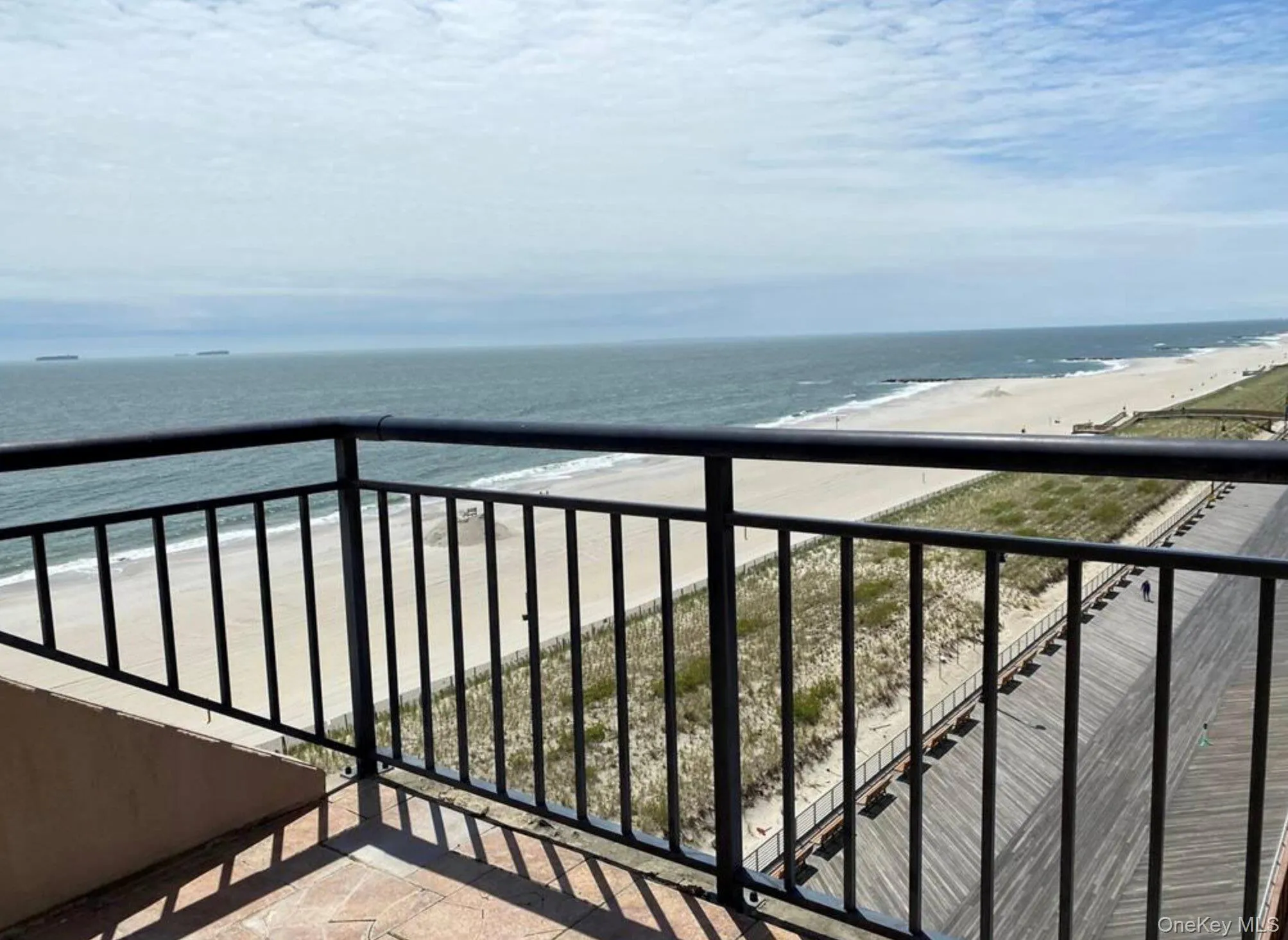 Balcony with a water view and a beach view Balcony with a water view and a beach view