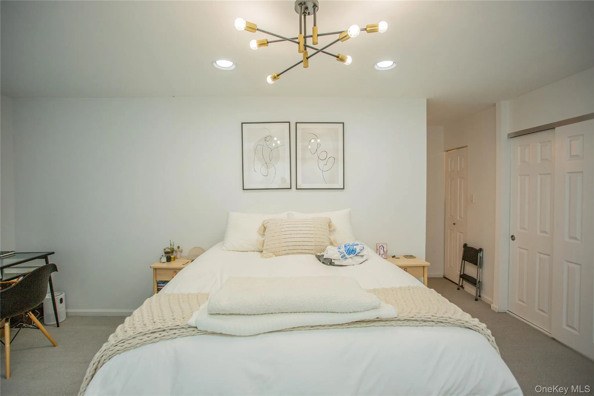 Bedroom featuring light colored carpet, a chandelier, baseboards, and recessed lighting Bedroom featuring light colored carpet, a chandelier, baseboards, and recessed lighting