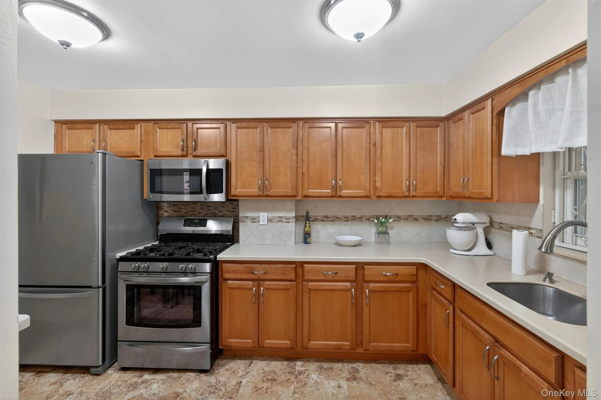Updated Kitchen featuring modern Kenmore Stainless Steel appliances Updated Kitchen featuring modern Kenmore Stainless Steel appliances