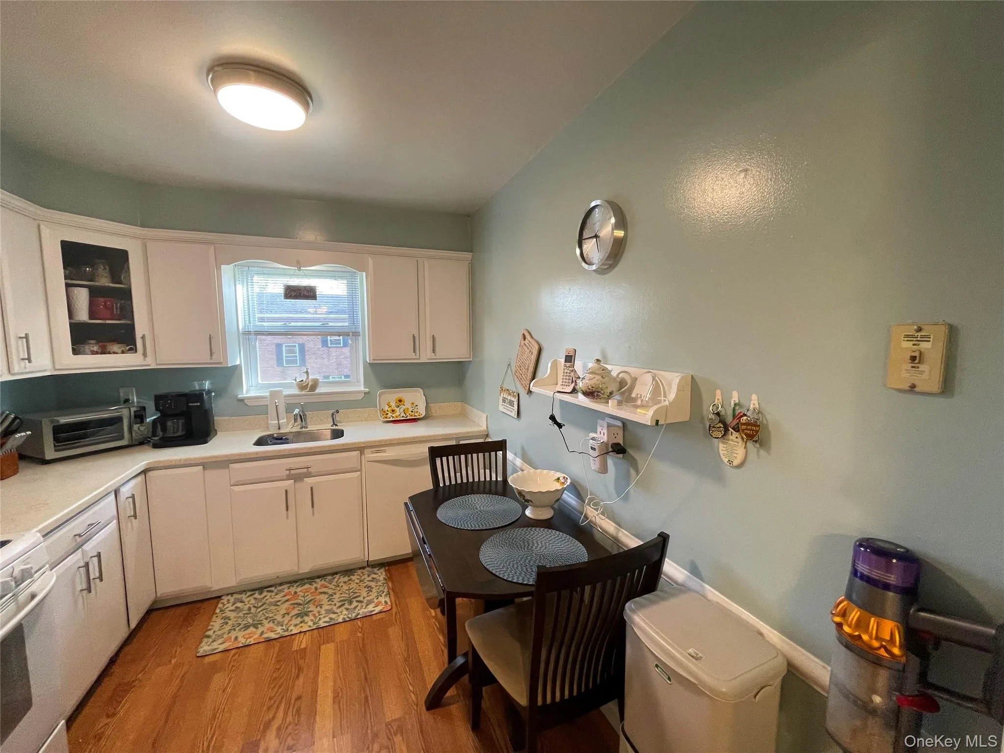 Bright new white cabinetry and light-filled sink window. Bright new white cabinetry and light-filled sink window.