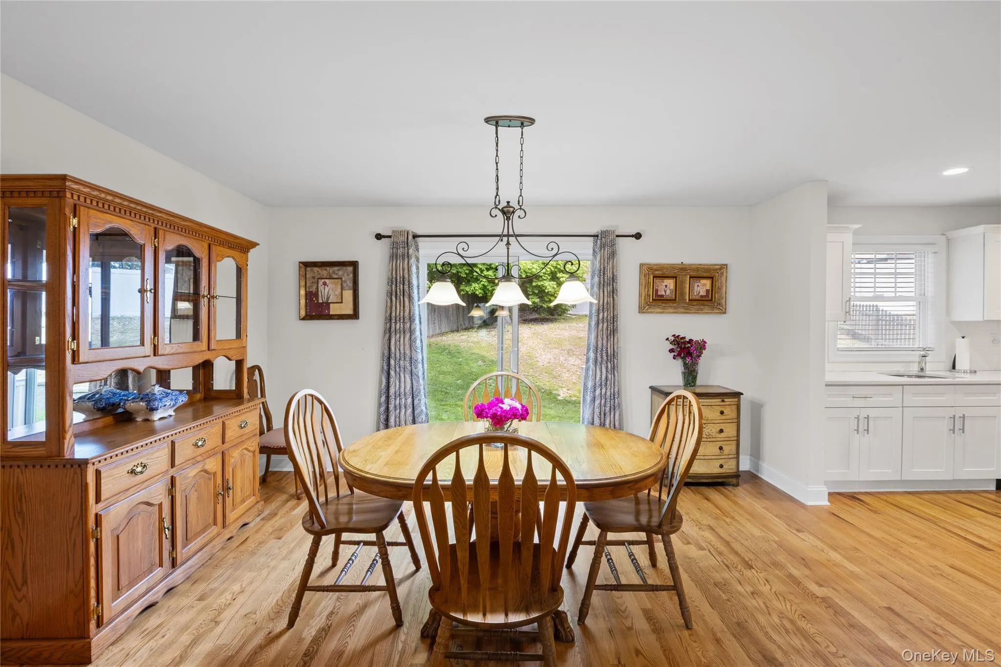Sliders in dining room keep the room light and bright and offer access to the private yard. Sliders in dining room keep the room light and bright and offer access to the private yard.
