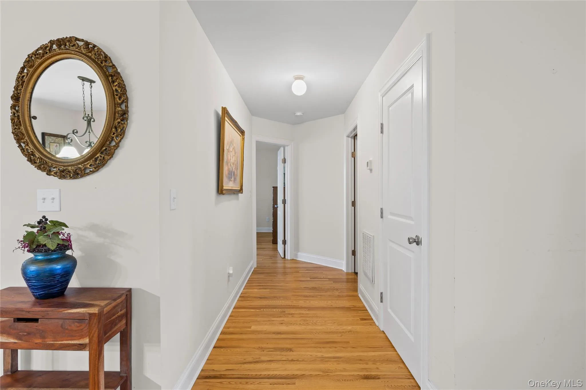 Main Level Hallway to Primary Bedroom and Laundry Room. Main Level Hallway to Primary Bedroom and Laundry Room.