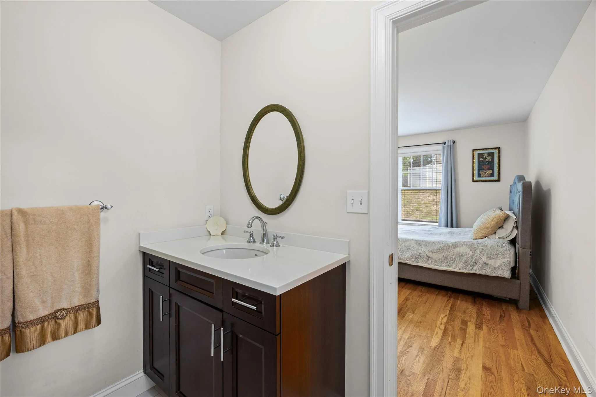 Primary ensuite bathroom w/single vanity and shower. Primary ensuite bathroom w/single vanity and shower.