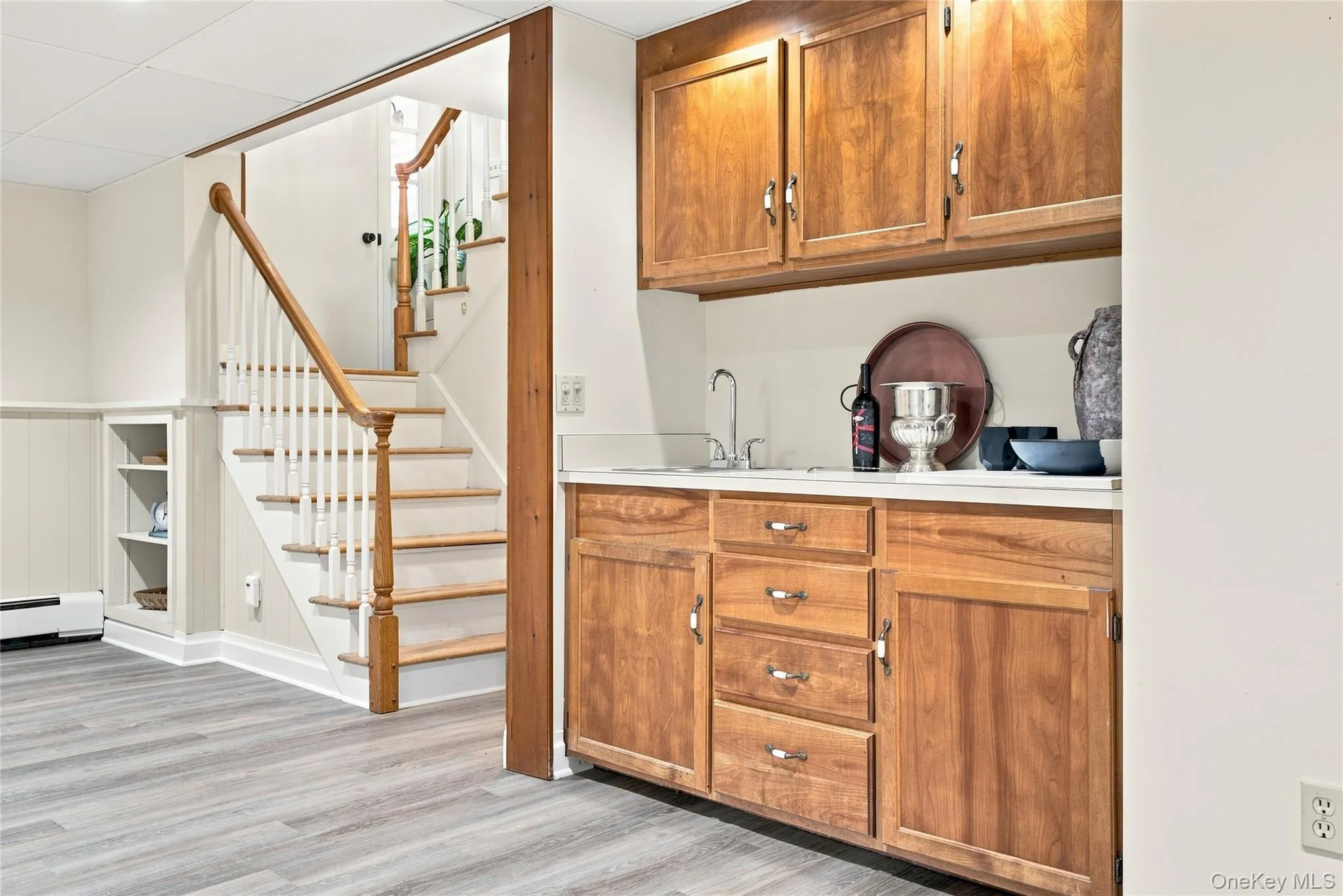 Stairs to lower finished living space. Wet Bar , full bath and more. Stairs to lower finished living space. Wet Bar , full bath and more.