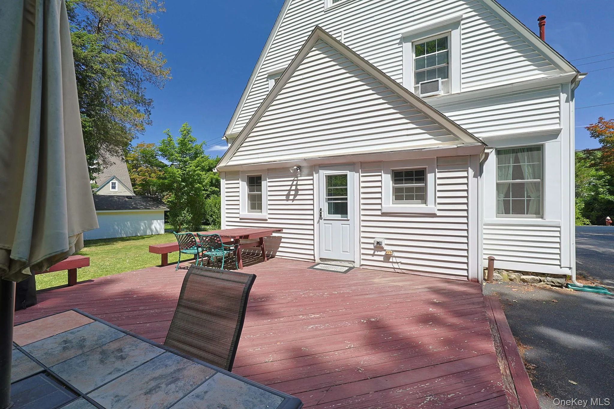 Expansive wooden deck with a red finish Expansive wooden deck with a red finish
