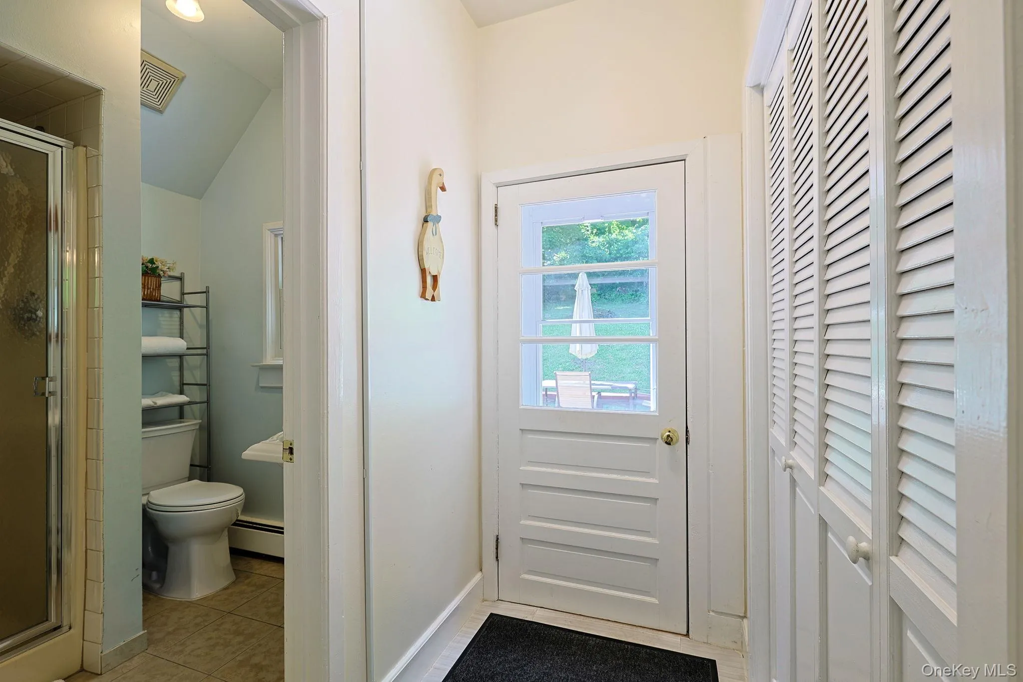 First floor full bath off kitchen area and outdoor entry leading to backyard First floor full bath off kitchen area and outdoor entry leading to backyard