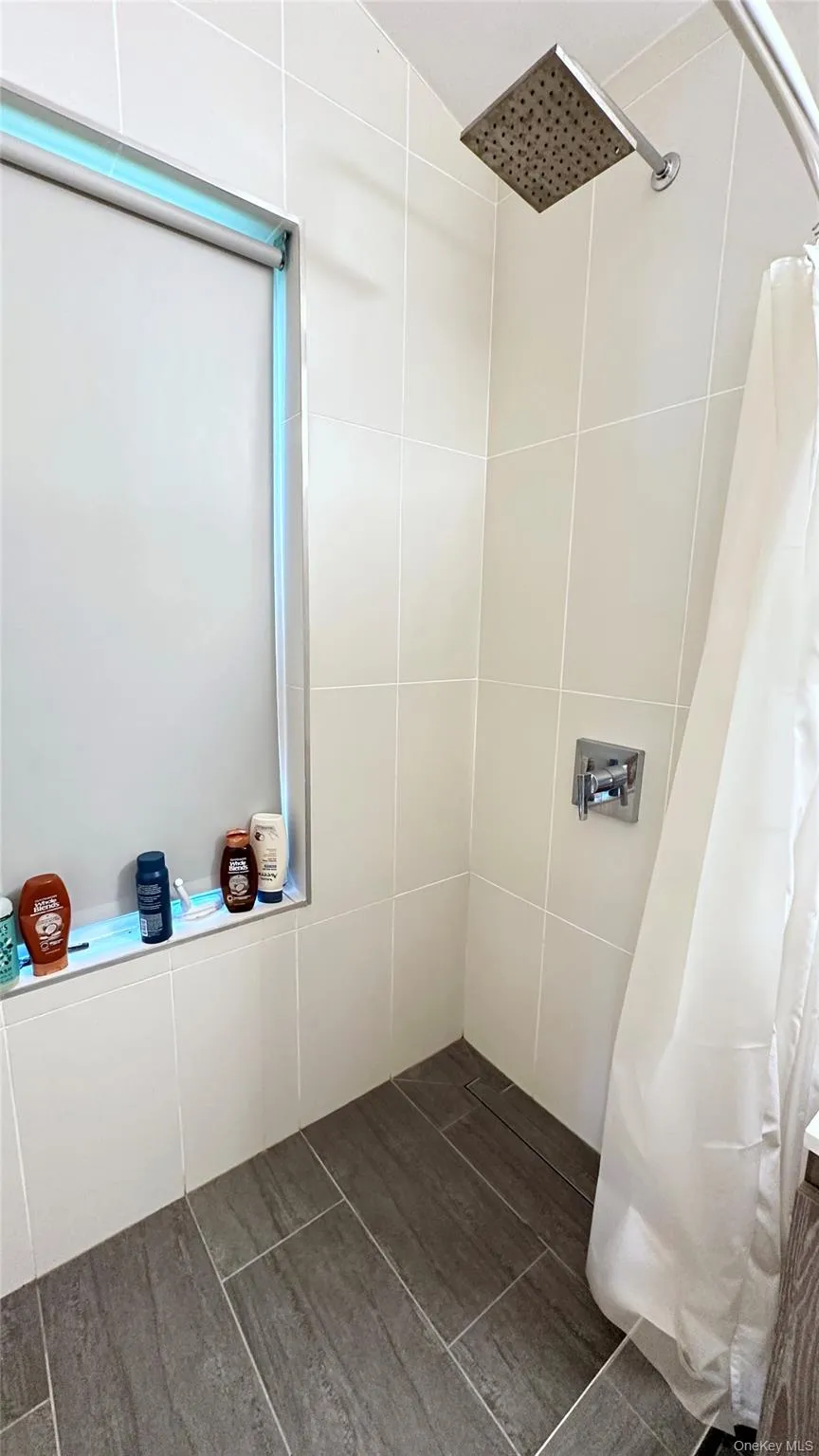 Bathroom with a tile shower Bathroom with a tile shower
