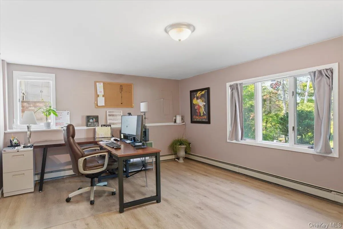 Bedroom number 4 on the lower level is currently being used as an office. Bedroom number 4 on the lower level is currently being used as an office.