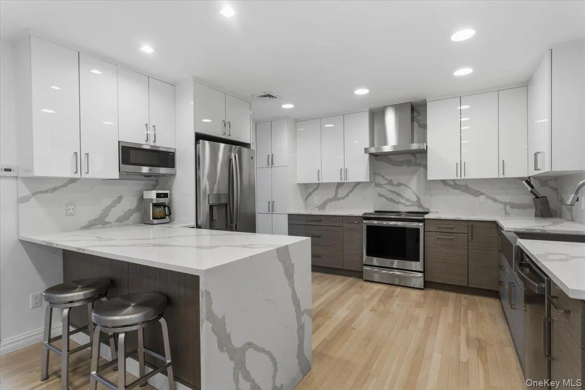 Move right into this fully renovated home featuring an open kitchen with a waterfall countertop and modern finishes throughout. Move right into this fully renovated home featuring an open kitchen with a waterfall countertop and modern finishes throughout.