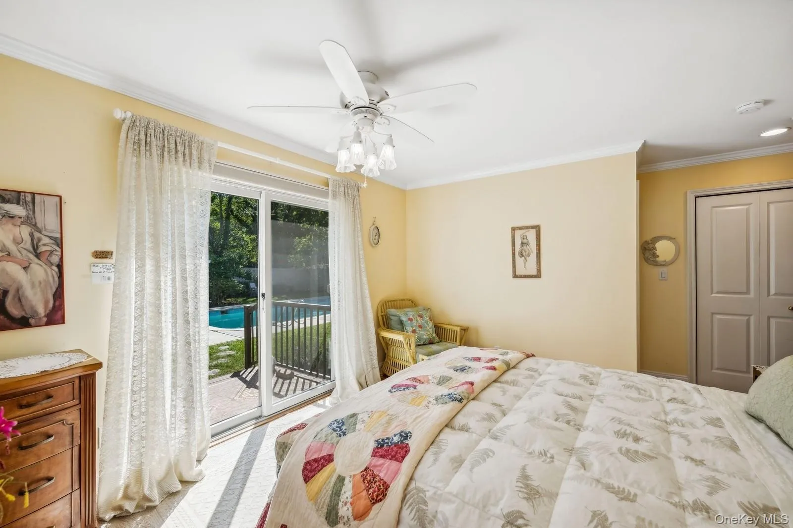 Primary Bedroom with sliders to outdoor shower and backyard Primary Bedroom with sliders to outdoor shower and backyard