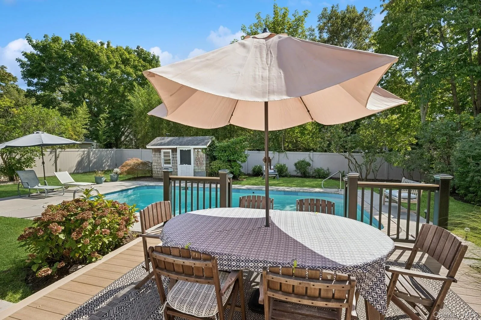 Outdoor furniture with umbrella on the new deck Outdoor furniture with umbrella on the new deck