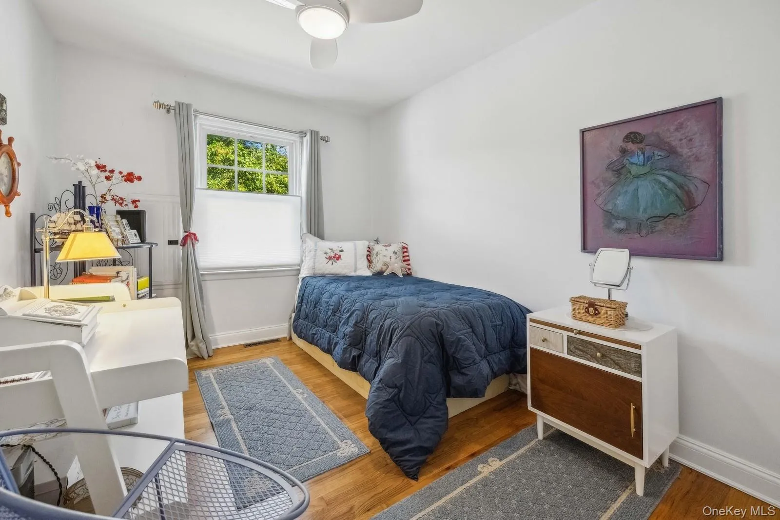 Bedroom 3 with hardwood floor, desk, large closet and ceiling fan Bedroom 3 with hardwood floor, desk, large closet and ceiling fan