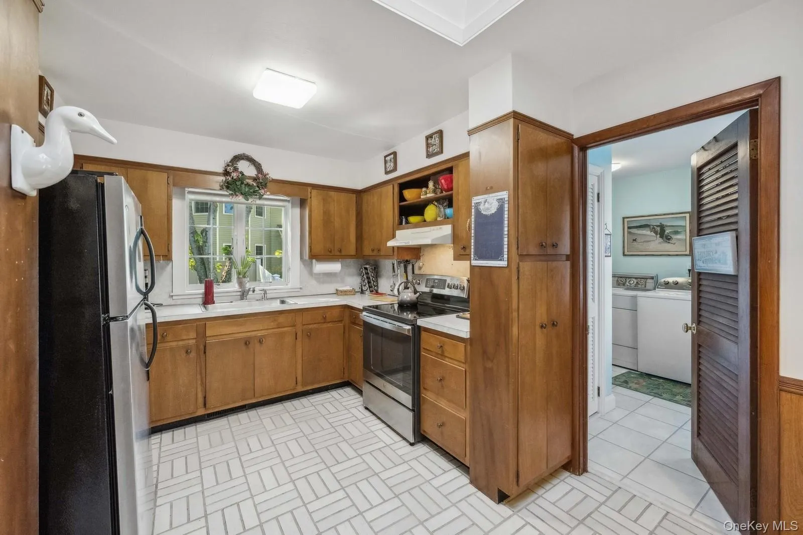 Kitchen with view of laundry room Kitchen with view of laundry room