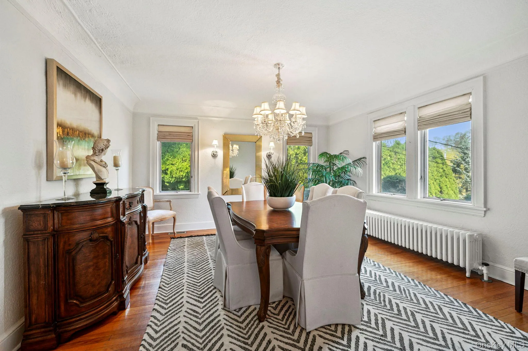 Dining room with hardwood floors and abundance of windows Dining room with hardwood floors and abundance of windows