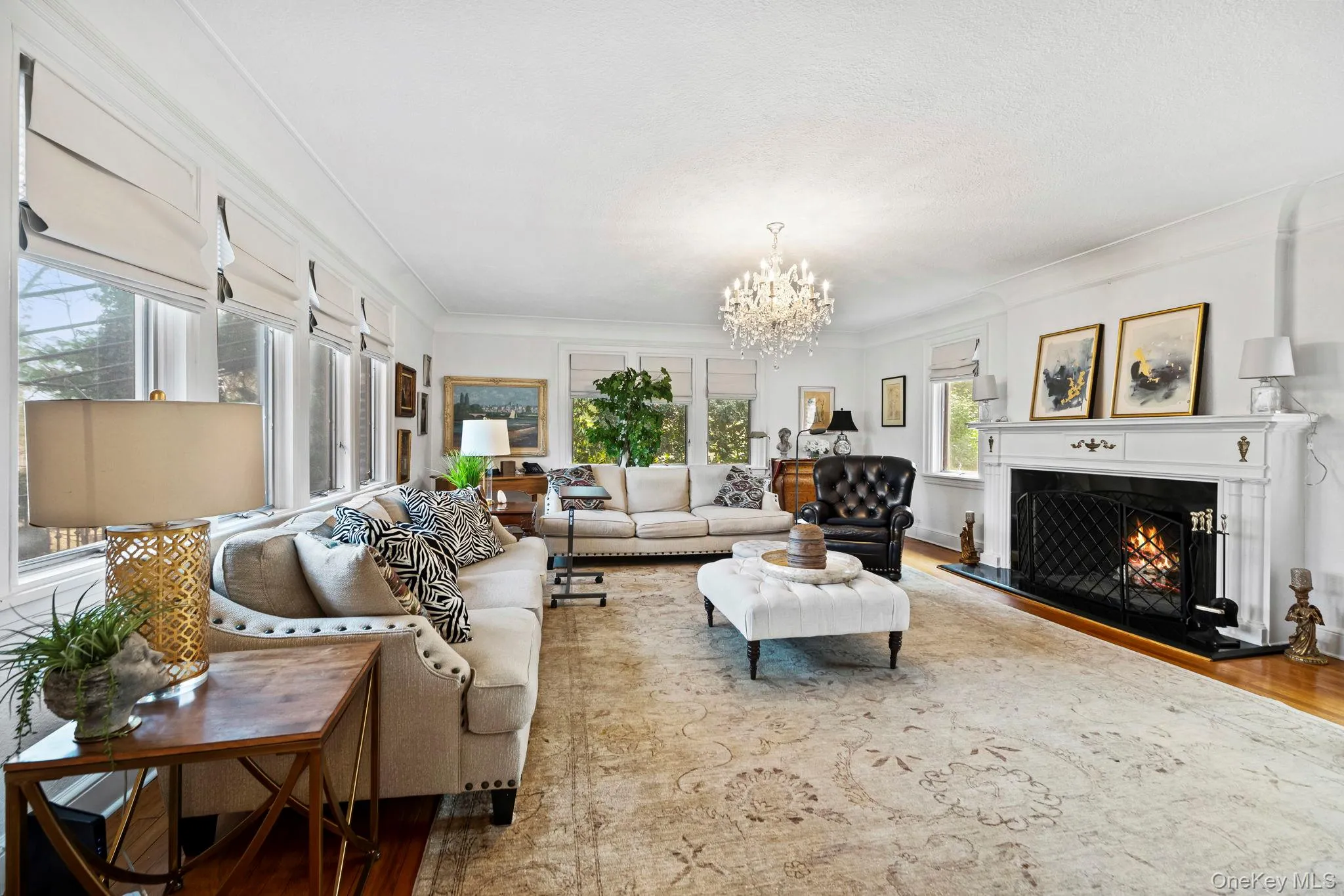 Large Living Room with beautiful mantle wood burning fireplace Large Living Room with beautiful mantle wood burning fireplace