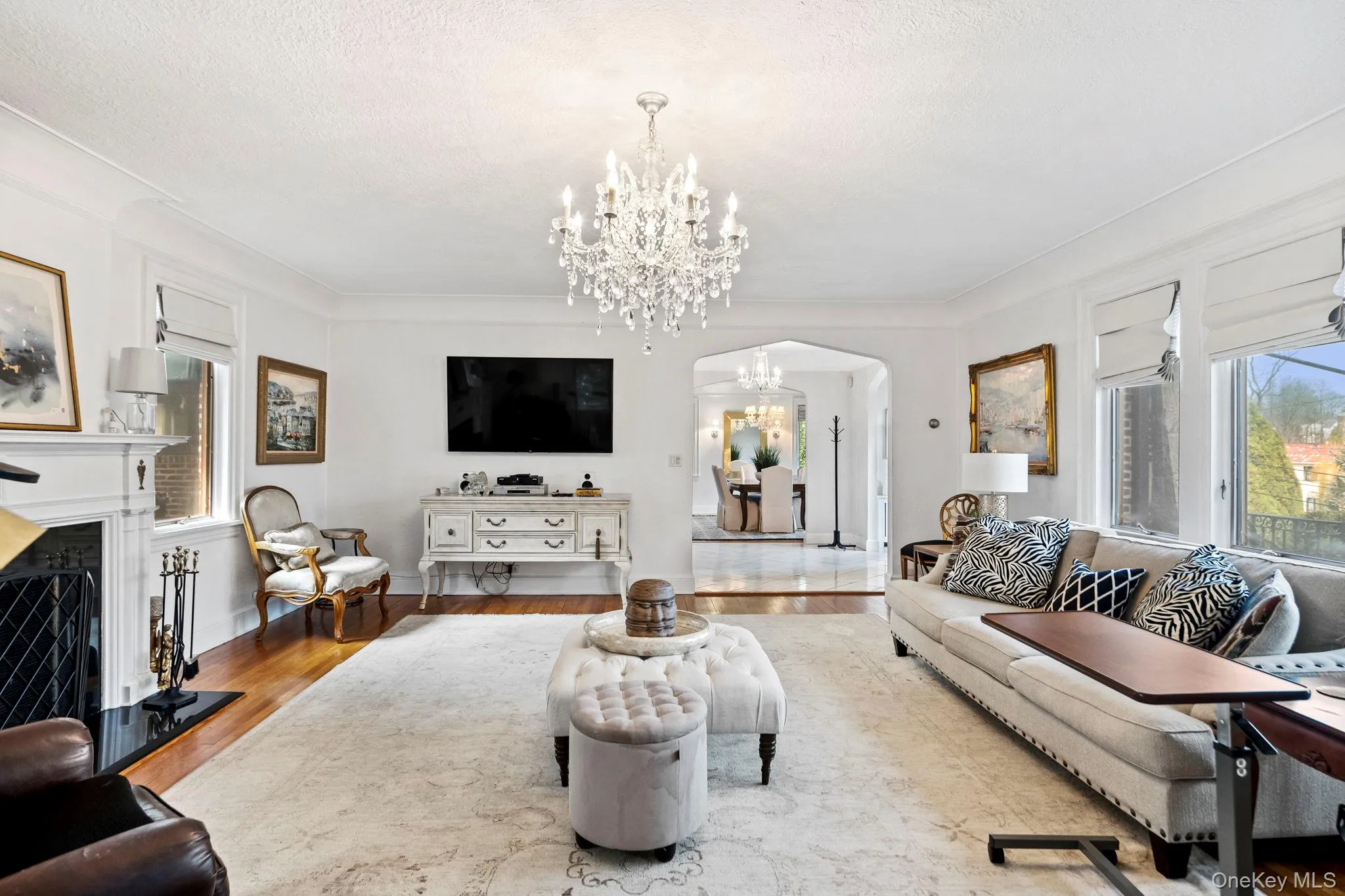 Living Room embraces sunlight with surrounding windows Living Room embraces sunlight with surrounding windows