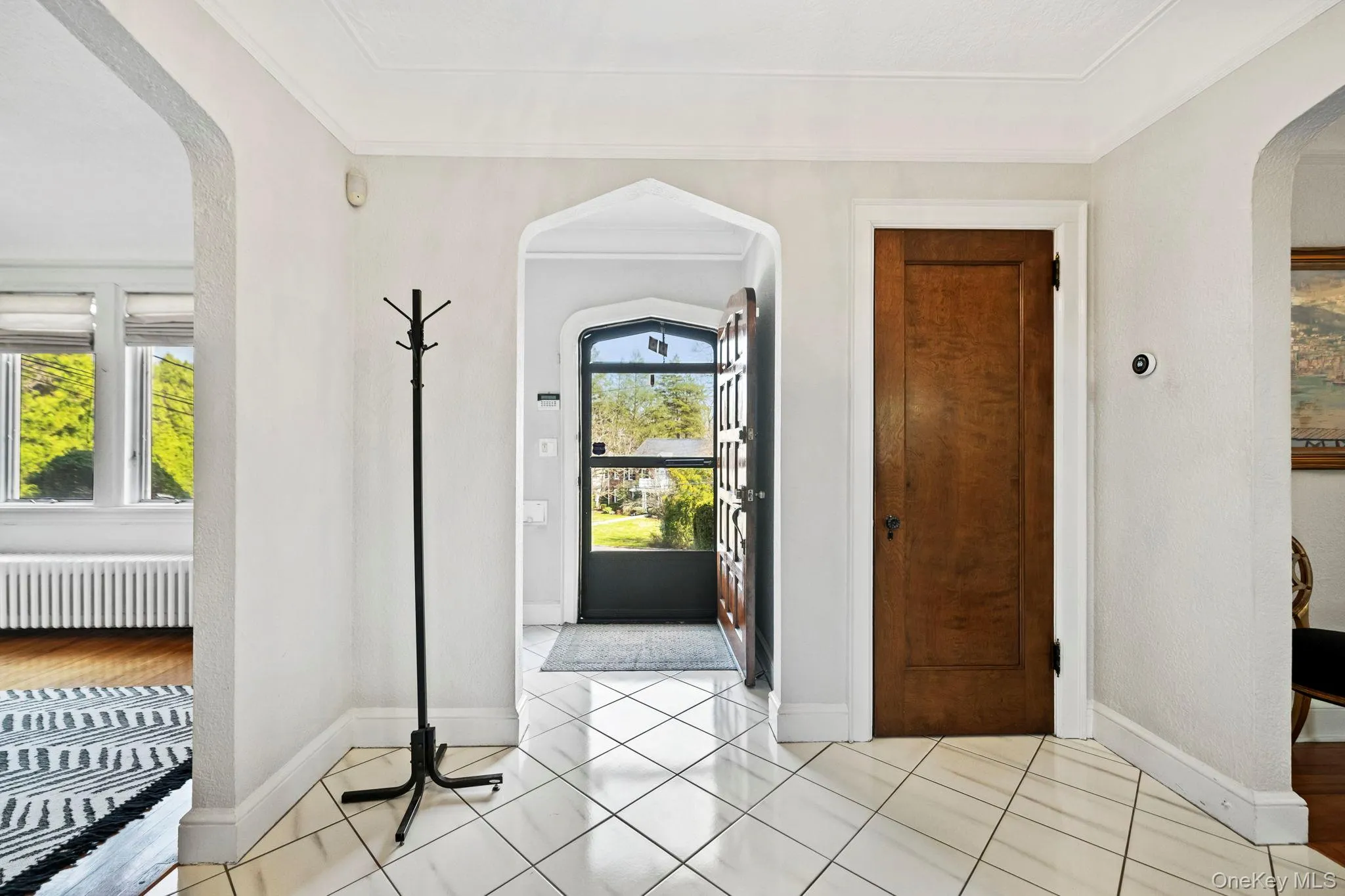 Entry Foyer with classic Tudors archways and large coat closet Entry Foyer with classic Tudors archways and large coat closet