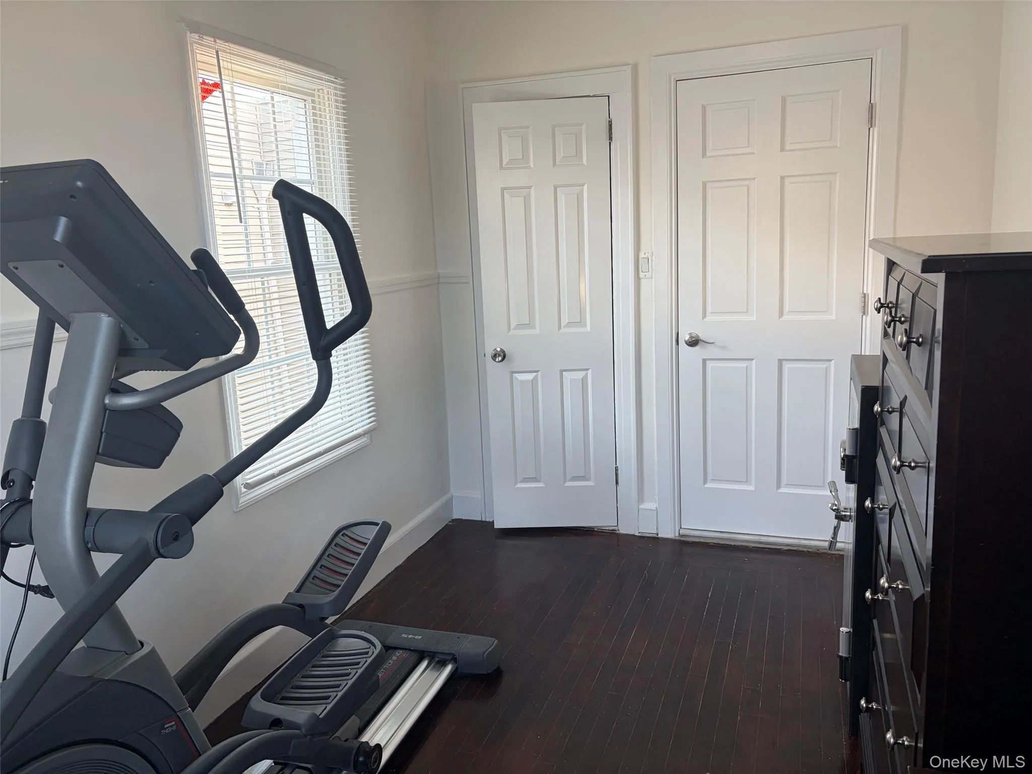 Bright bedroom with hardwood floors. Bright bedroom with hardwood floors.