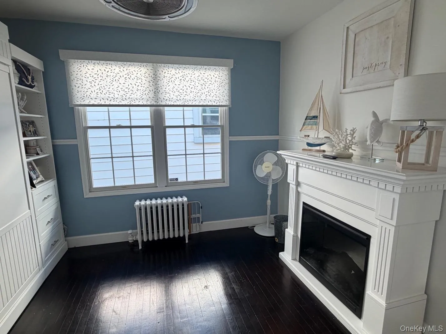Bedroom with murphy bed unit and electric firplace. Bedroom with murphy bed unit and electric firplace.
