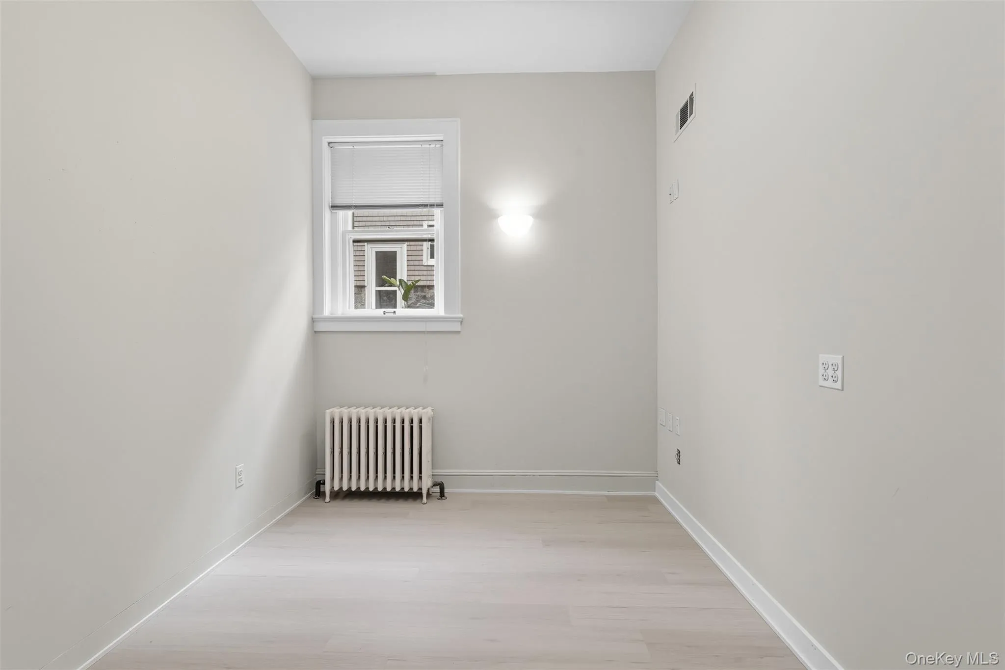 Light gray walls complement the wood-finish flooring Light gray walls complement the wood-finish flooring