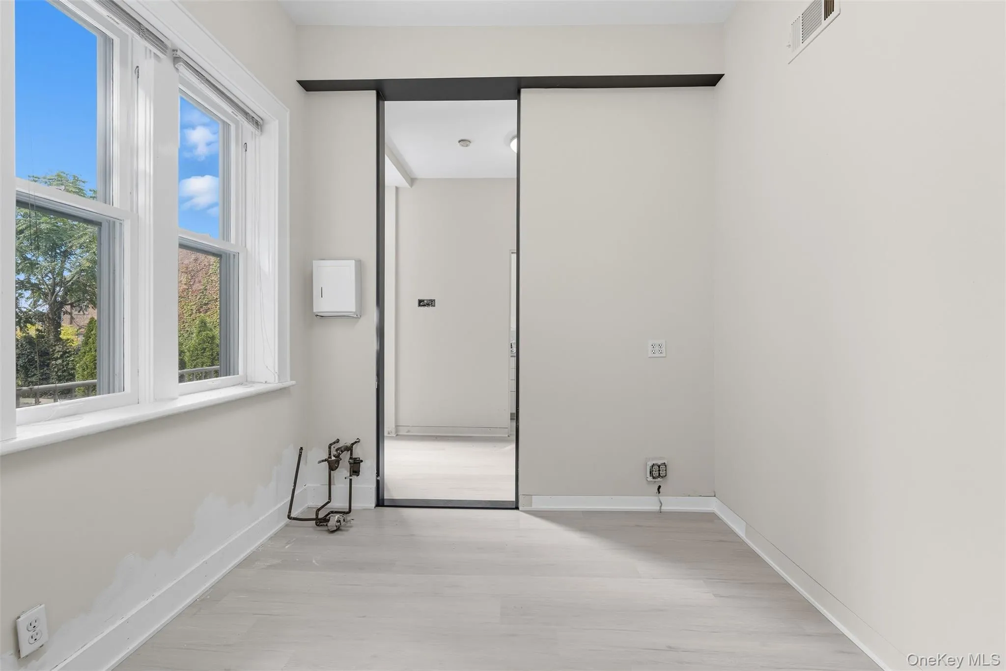 Light wood-finish flooring complements neutral wall tones Light wood-finish flooring complements neutral wall tones