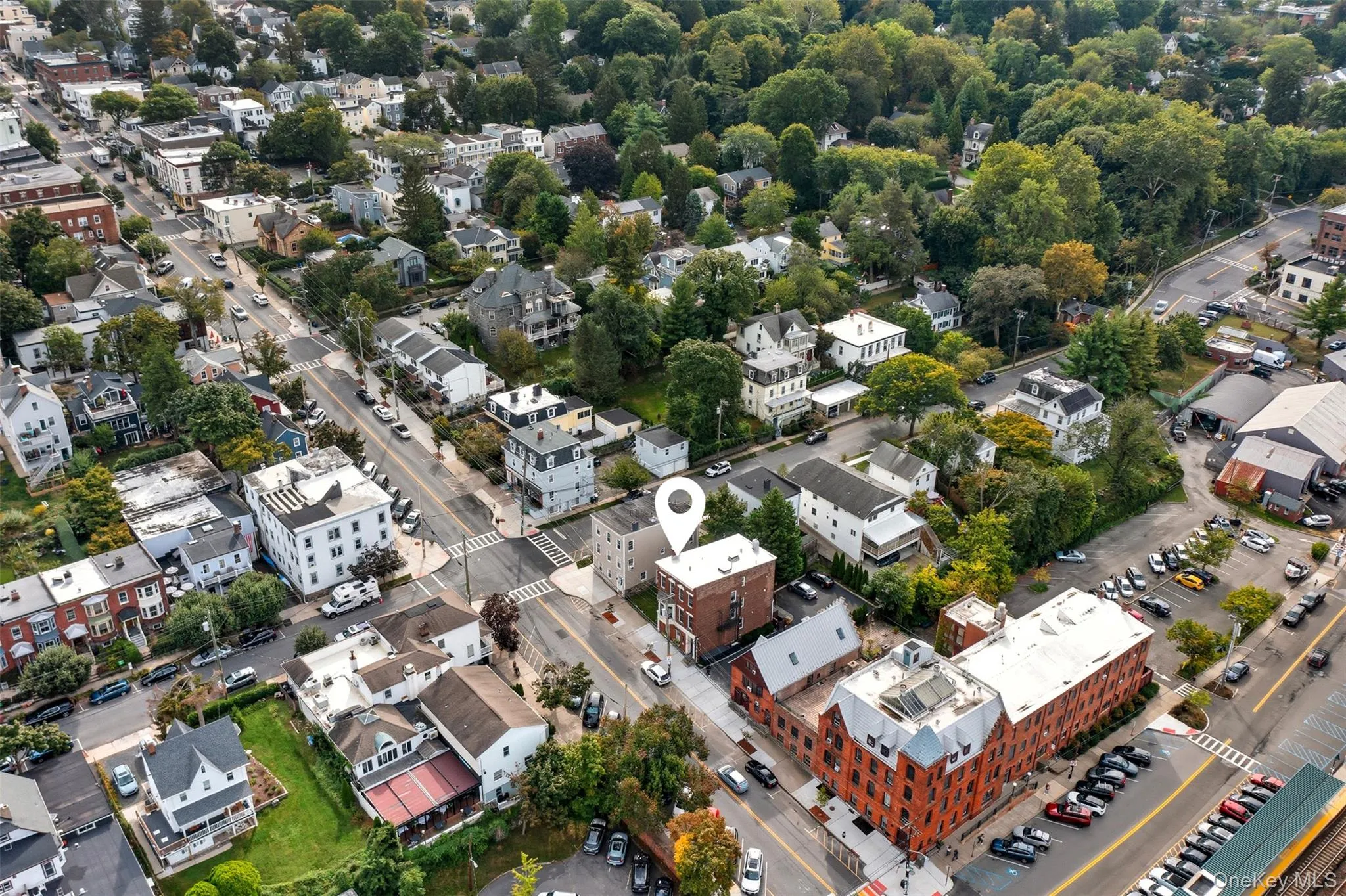 Urban streetscape featuring a prominent multi-story building with a flat roof Urban streetscape featuring a prominent multi-story building with a flat roof