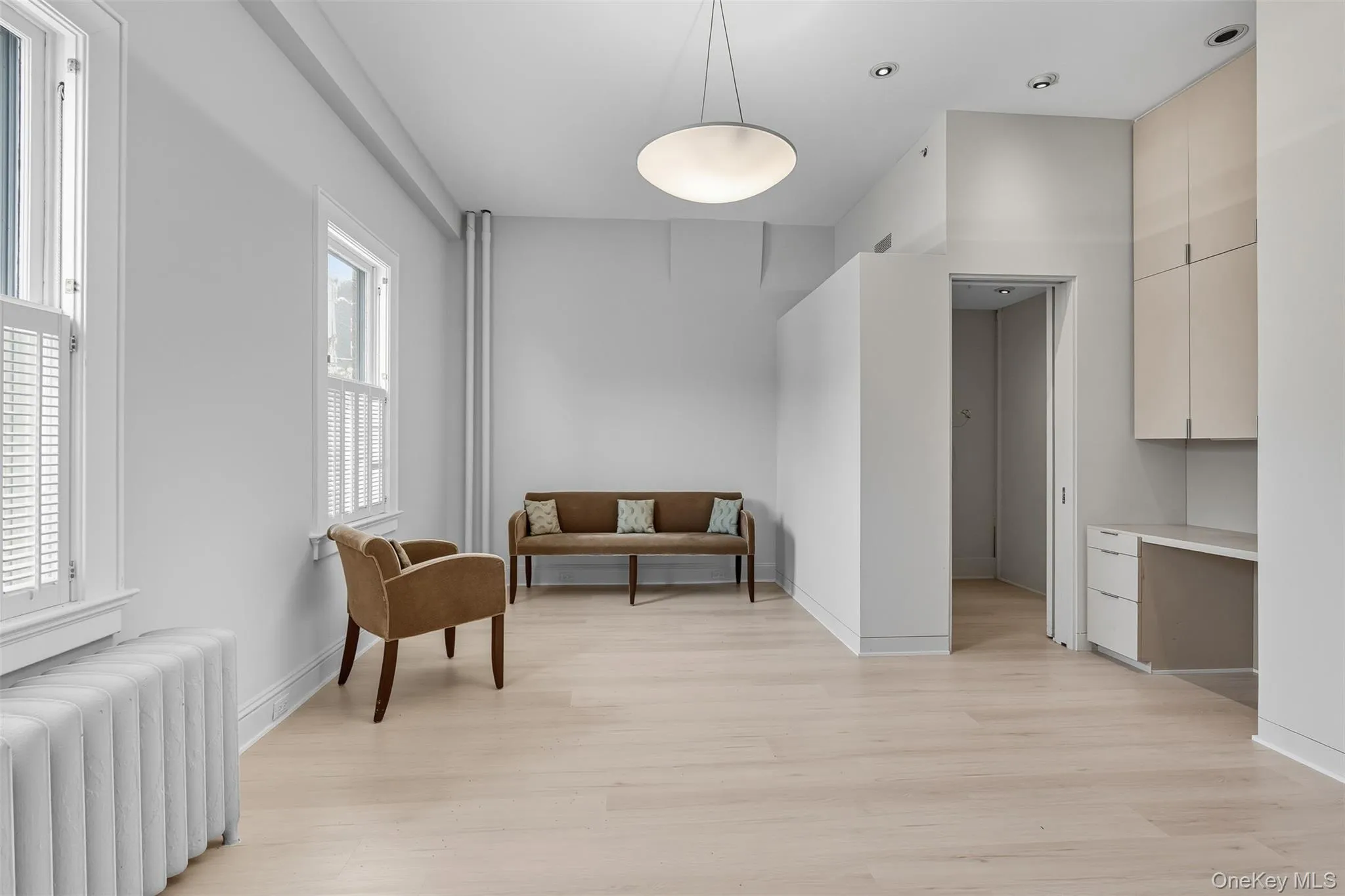 Light wood-finish flooring complements the neutral wall tones Light wood-finish flooring complements the neutral wall tones