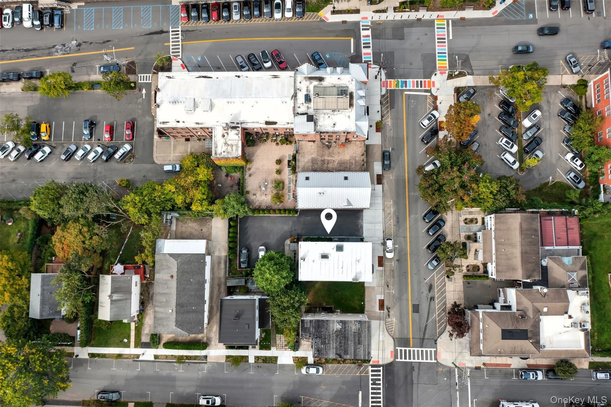 Aerial perspective showcasing a commercial property within a vibrant urban setting Aerial perspective showcasing a commercial property within a vibrant urban setting