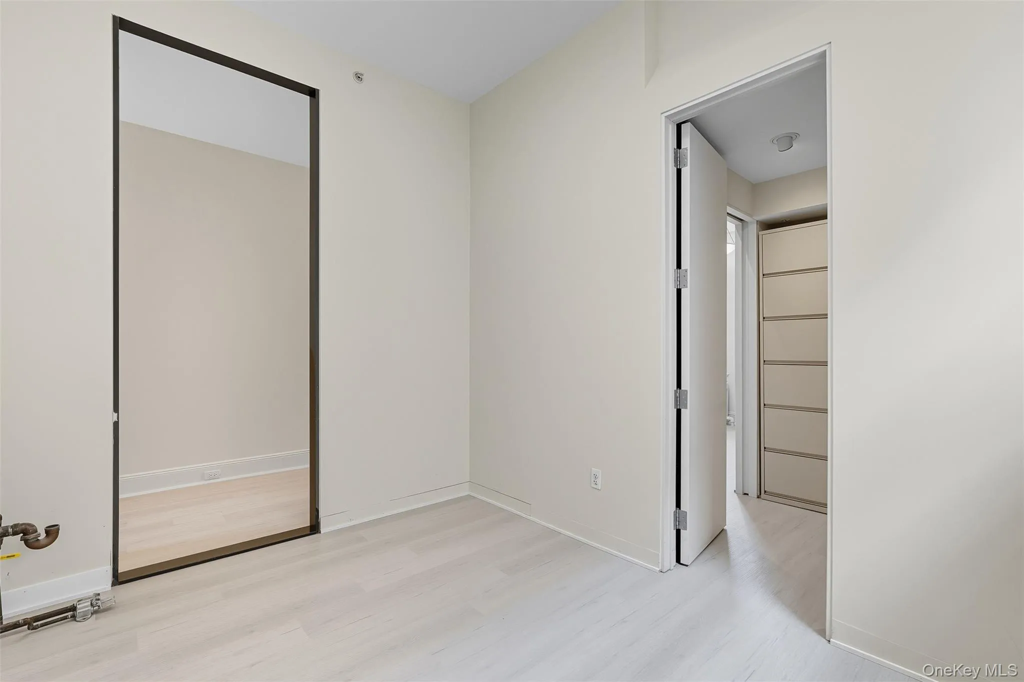 Light wood-finish flooring complements neutral wall tones Light wood-finish flooring complements neutral wall tones