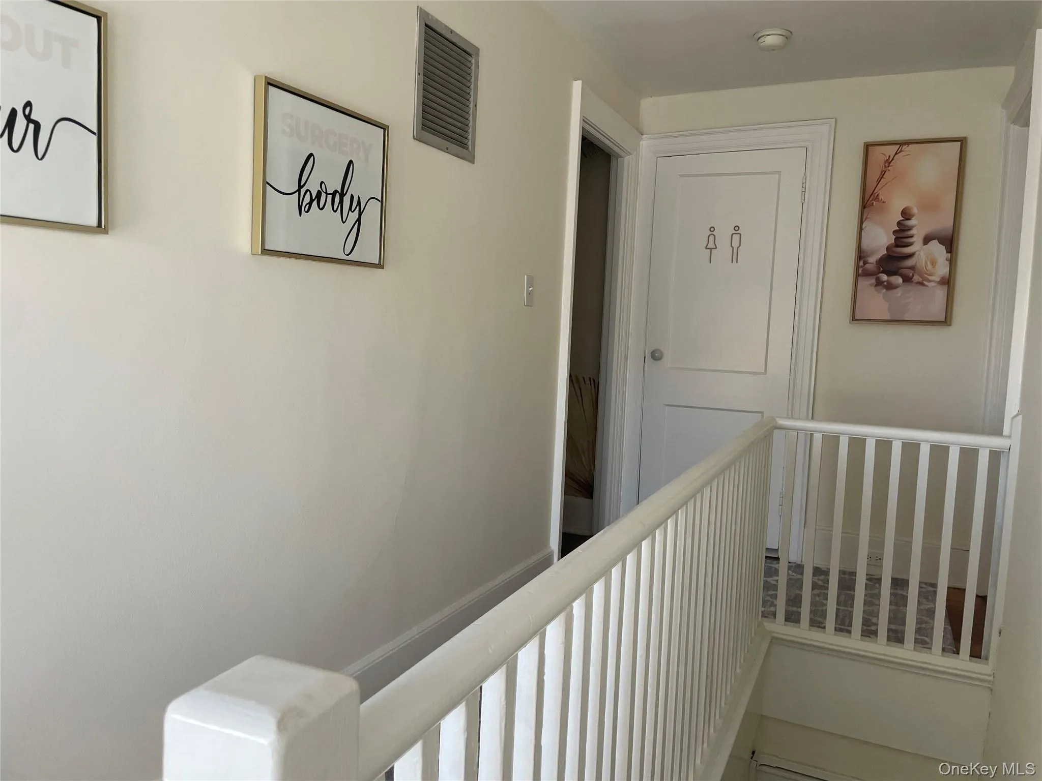 Crisp white interior walls with a matching white painted railing Crisp white interior walls with a matching white painted railing