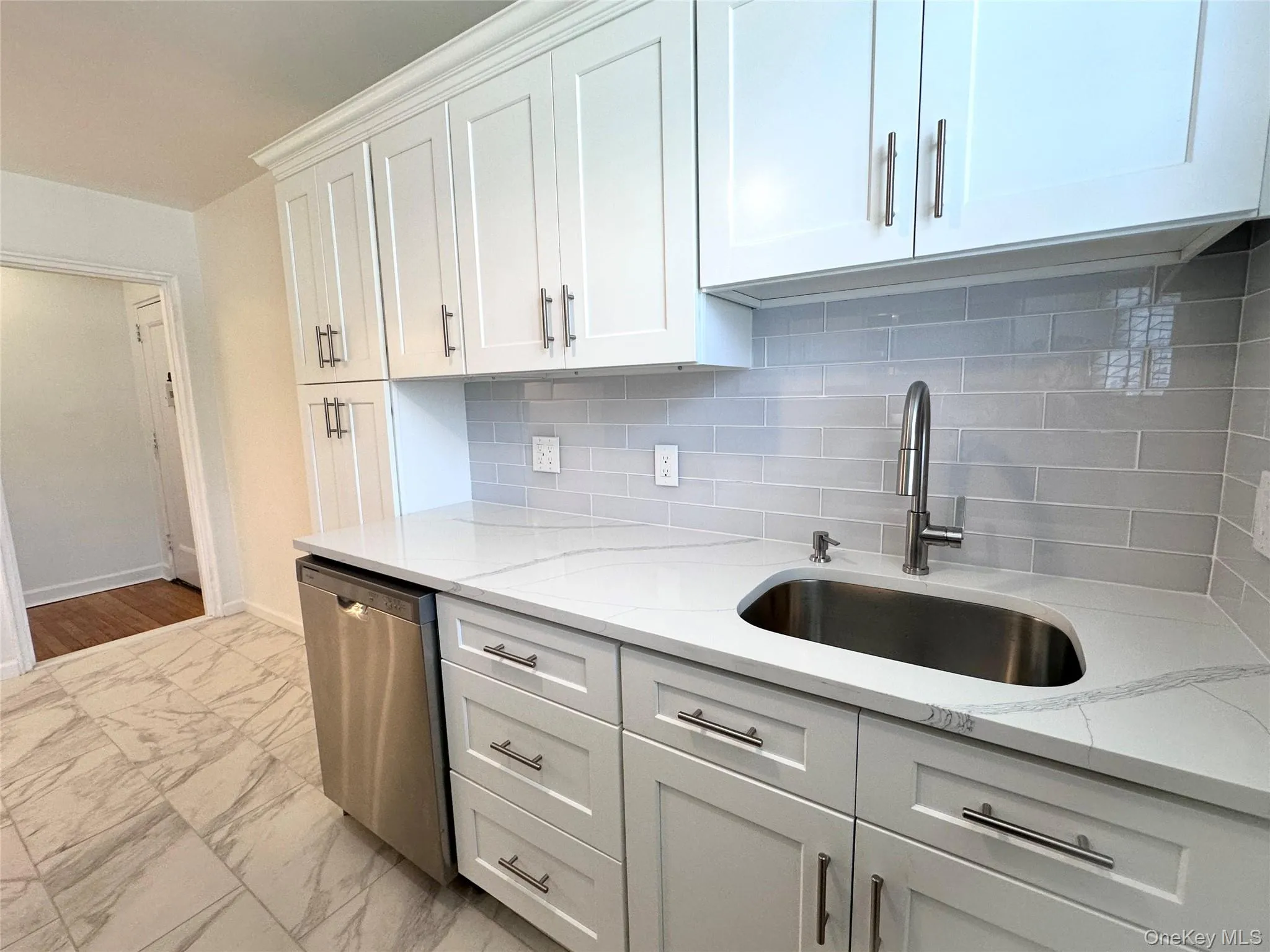 Brand new dishwasher, stainless steel; view towards hall Brand new dishwasher, stainless steel; view towards hall