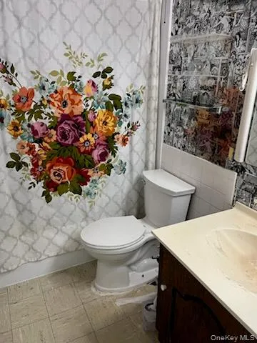 Full bathroom with tub. Full bathroom with tub.